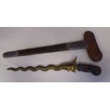 A 19thC kris, the fruitwood handle overlaid with impressed white metal, the partially gilded and
