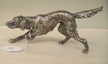 A cast silver coloured metal model, an Irish setter in crouching pose  stamped 925  4"h
