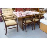A 1950s mahogany dining table, raised on planked ends  30"h  50"L; and a matching set of six chairs