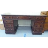 A late Victorian mahogany nine drawer twin pedestal desk  29"h  55"w