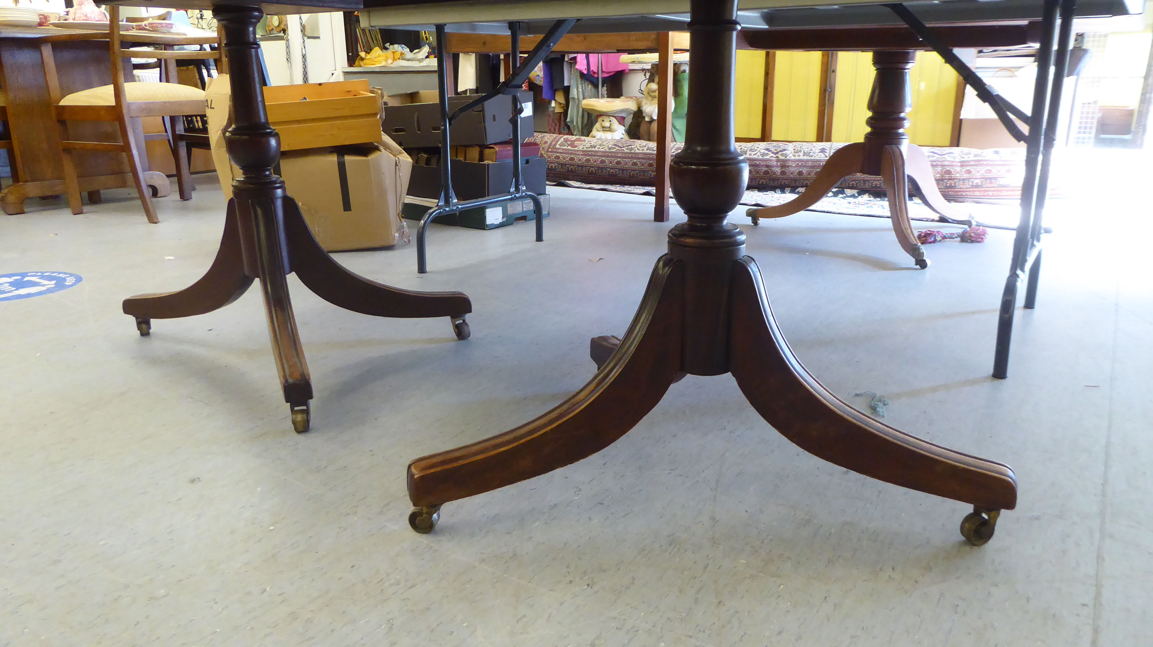 A late George III ebony inlaid, crossbanded mahogany, twin pedestal dining table, raised on splayed, - Image 4 of 4