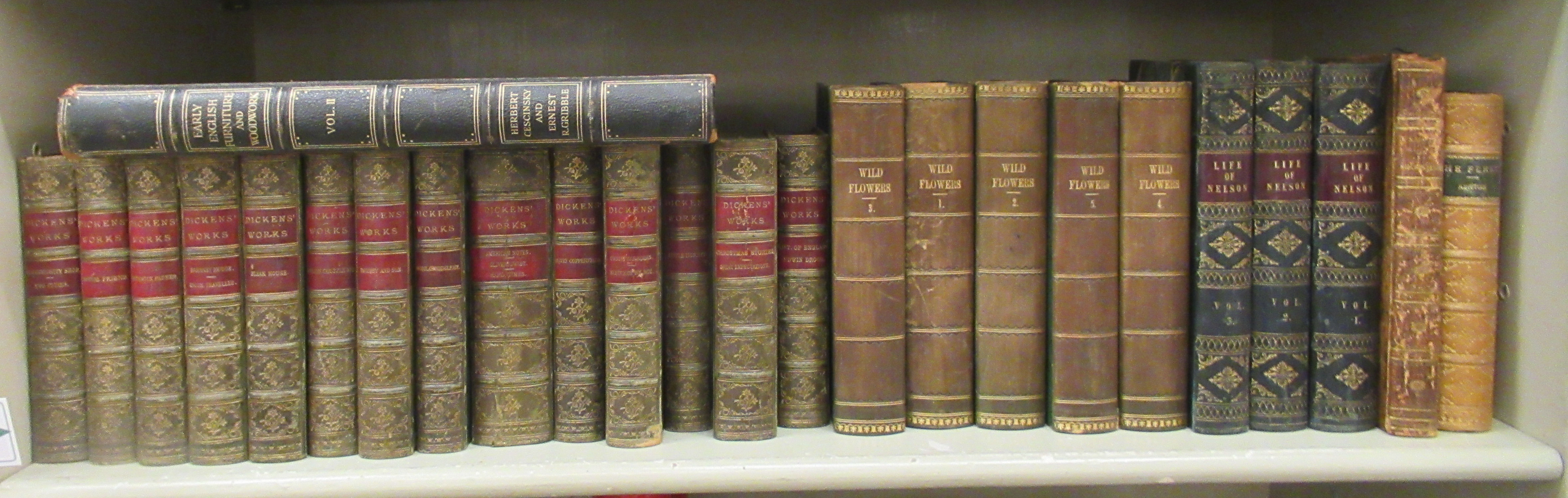 Books: to include works by Charles Dickens, published in fourteen half-calf bound volumes by Chapman