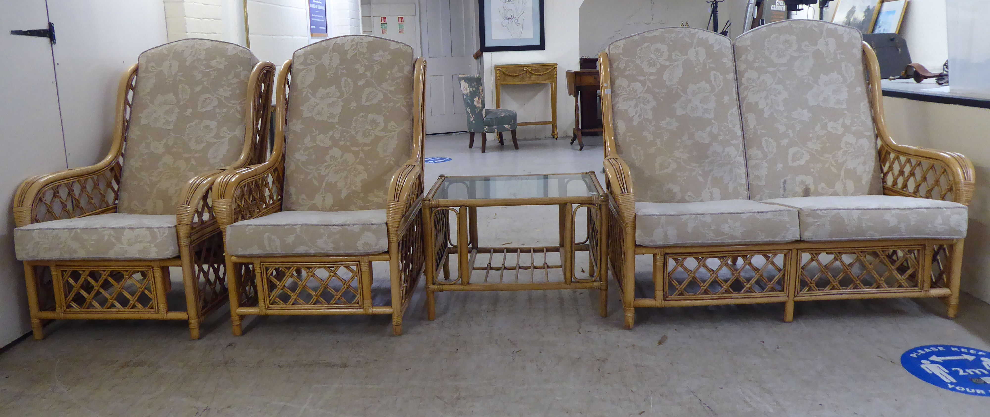 A modern bamboo framed conservatory suite, comprising a two person settee and a pair of armchairs