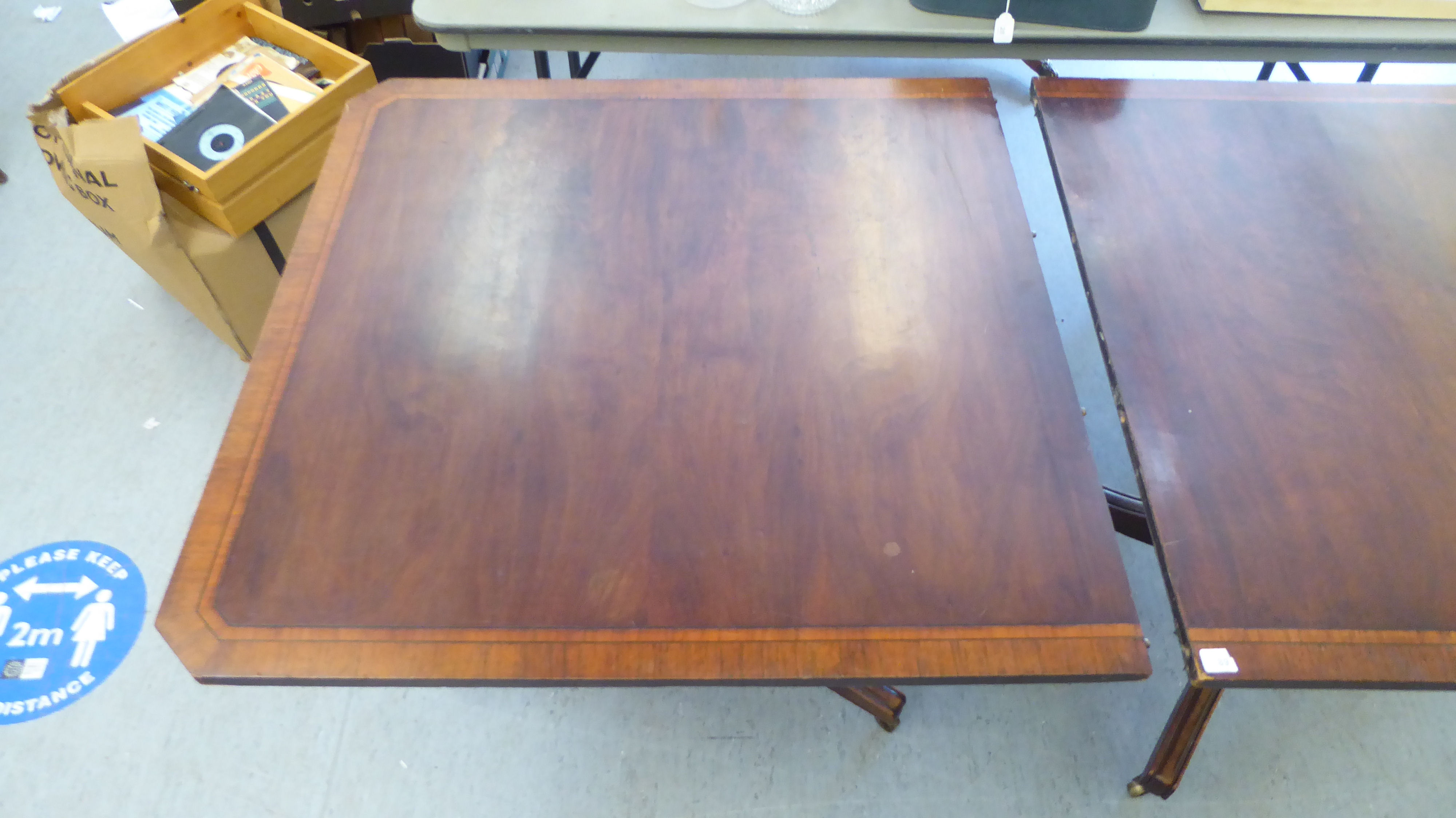 A late George III ebony inlaid, crossbanded mahogany, twin pedestal dining table, raised on splayed, - Image 2 of 4