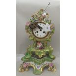 An early 20thC Continental porcelain bracket clock, faced by a Roman dial  16"h overall