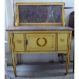 An Edwardian cream painted washstand with a marble back and top, over a door, raised on square,