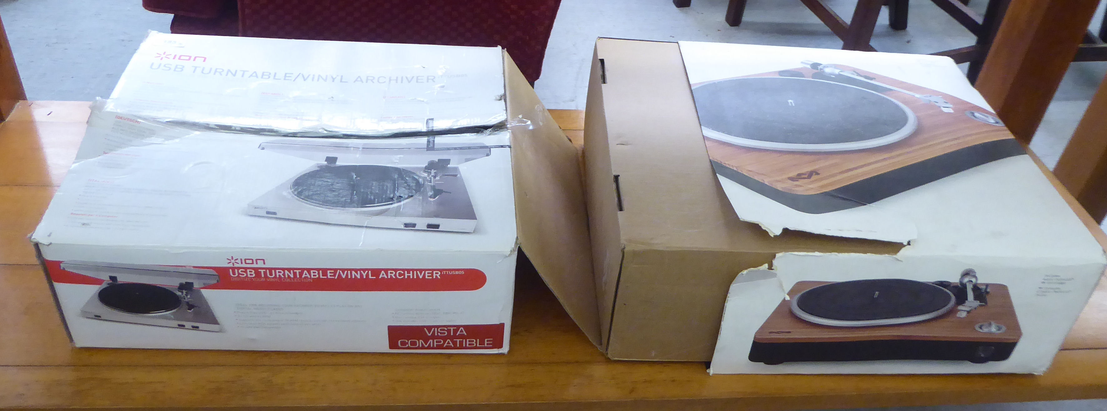 An Ion Furniture/vinyl archiver; and a Bob Marley turntable  both boxed