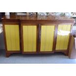 A Regency rosewood and mahogany breakfast sideboard with four glazed doors, raised on bracket