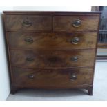 An early 19thC mahogany bowfront dressing chest with two short/three graduated long drawers,
