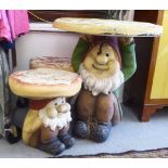 Painted moulded composition novelty garden furniture, comprising a gnome and toadstool table  26"
