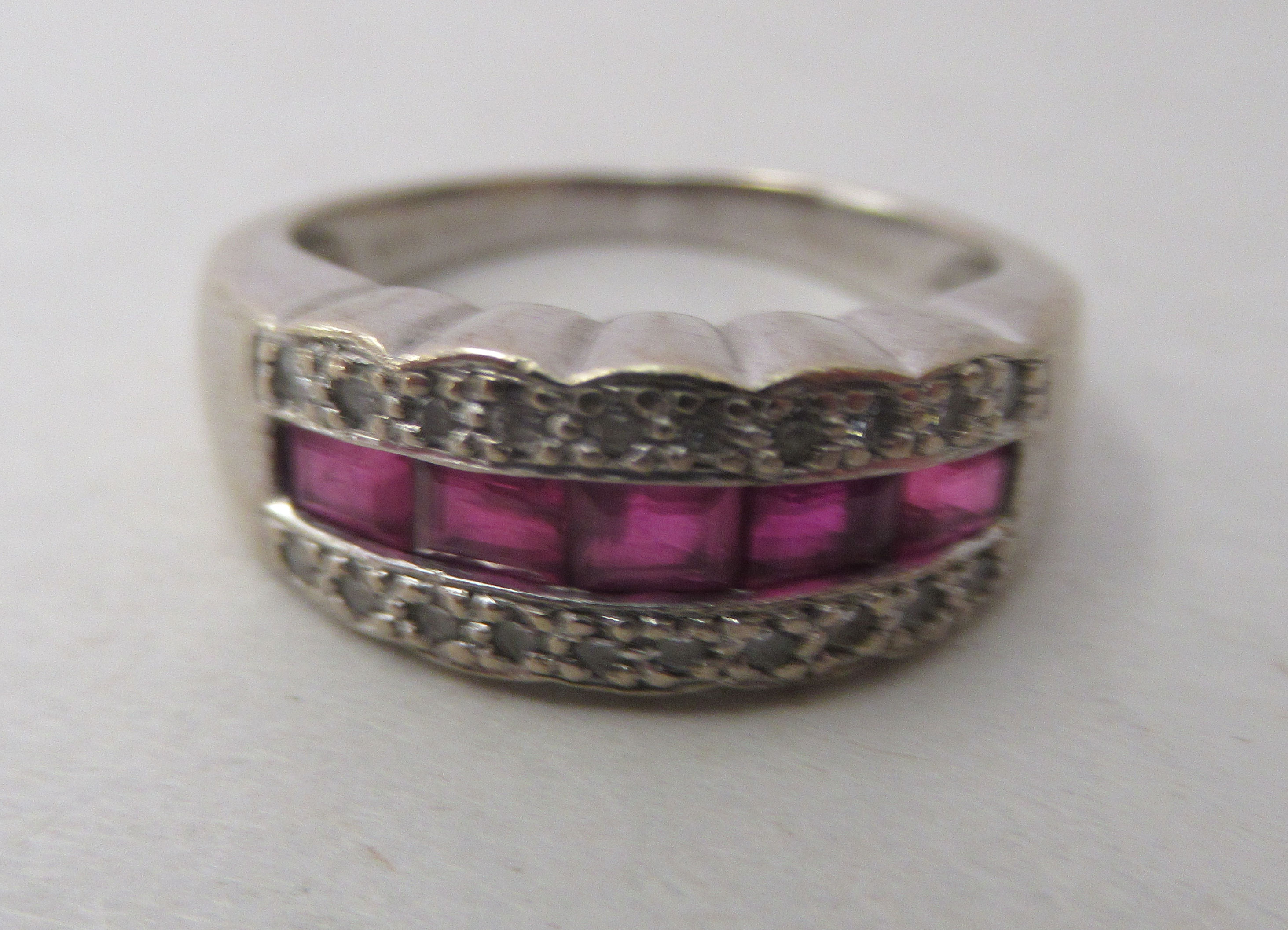 An 18ct white gold, ruby and diamond set ring