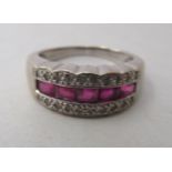 An 18ct white gold, ruby and diamond set ring