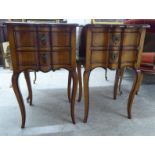 A pair of late 20thC walnut, serpentine front bedside chests, each with two drawers, raised on
