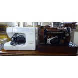A Singer manual sewing machine; and a Janome electric sewing machine  both cased
