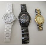 Three similar modern designer bracelet watches, variously faced by baton Arabic and Roman dials