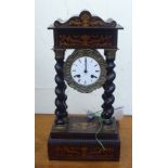 A late 19thC mahogany and marquetry portico clock; the 8 day movement faced by an enamelled Roman