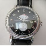 A stainless steel cased wristwatch, the automatic movement faced by a black Arabic and baton dial