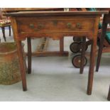 A late 18th/early 19thC country made fruitwood side table with an overhang planked top, a lockable