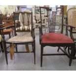 A George III mahogany framed elbow chair with a pierced splat back, the drop-in seat raised on