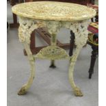 A late Victorian white painted, ornately cast iron pub table, raised on four legs  28"h  24"dia