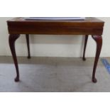 A modern mahogany (unfitted) box design canteen table with a tooled hide top, raised on cabriole