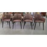 A set of four modern, low round back chairs with level arms, upholstered in aged, stitched, mid