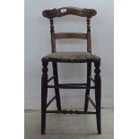 A child's mid 19thC mahogany twin bar back chair, raised on turned, tapered forelegs