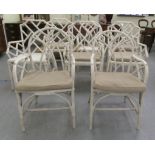 A set of four vintage white painted bamboo framed and split cane conservatory armchairs; and a