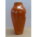 A Moorcroft Burslem pottery orange glazed vase of tapered form  9"h