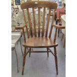 A modern beech and elm framed Windsor grandfather chair with a high slatted back and open arms,