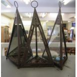 Three cast iron framed lanterns with ring handles of triangular form  29"h