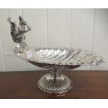 An early 20thC silver plated shell design nut dish, surmounted by a squirrel, elevated on a