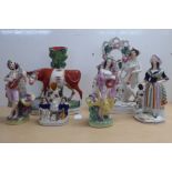 Six 19thC Staffordshire pottery ornaments: to include a Scotsman playing a lute  9"h; and a