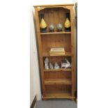 A modern pine open front, two tier bookcase, raised on bracket feet  70"h  26"w