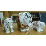 Three Royal Crown Derby china elephant paperweights, each with a gilt stopper  tallest 4"h