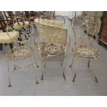 A pair of scrolled and white painted steel wire framed terrace chairs  comprising one open arm/one
