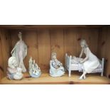 Five Lladro porcelain ornaments: to include a mother tending to a child  7"h