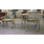 A Victorian style, white painted, cast alloy framed terrace suite, decorated with cast scrolls and