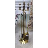 An early/mid 20thC lacquered brass, four piece fireside companion  27"h