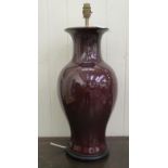 A modern sang du boeuf china table lamp of waisted baluster form  21"h