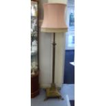 A mid 20thC Corinthian column design lacquered brass standard lamp, elevated on a stepped square