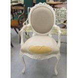 A modern white painted open arm bedroom chair, raised on cabriole forelegs