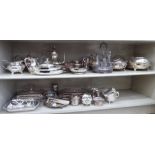 Silver plated tableware: to include a pair of sauce boats; a four piece cruet with glass bottles;