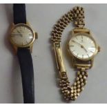 Two similar lady's Omega 9ct gold, round cased wristwatches, one on a flexible link bracelet, the