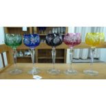 A set of five clear crystal hock glasses with differently coloured bowls