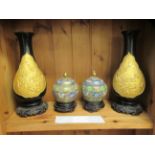 Modern Oriental ornaments, viz. a pair of gilded black composition, ovoid shape vases  13"h; and a