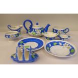 A Mak Merry china breakfast set, decorated in blue, white and green with apple blossom, comprising a