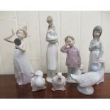 Seven Nao porcelain ornaments: to include a young girl holding a handmirror  8"h