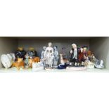 Decorative ceramics: to include a pair of lions  4"h; and a German porcelain figure, a flower