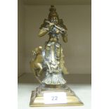 An early 20thC Indian patinated bronze figure, a deity  8"h